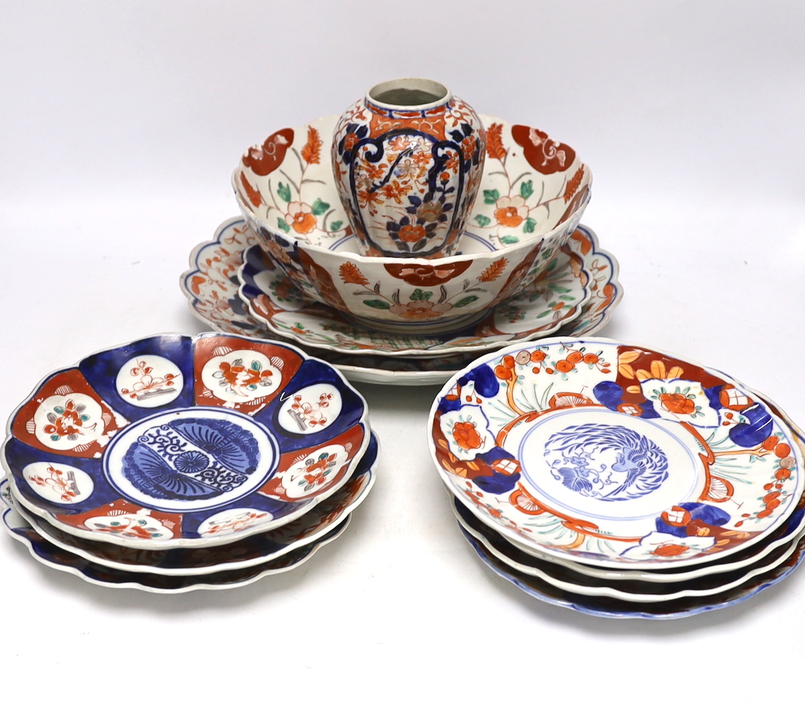 A group of Japanese Imari plates, dishes, a bowl and a vase